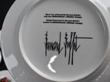 a white plate with a black writing on it