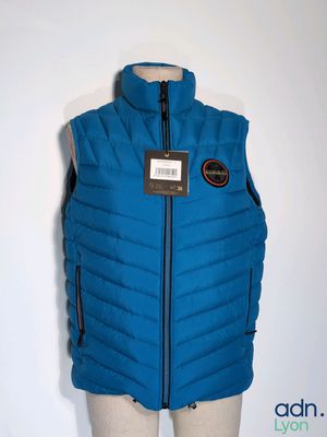the vest is blue and has a black label on it