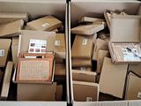 two boxes of boxes that are sitting in the back of a truck