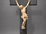 a statue of jesus on the cross with a sign that says jesus on it