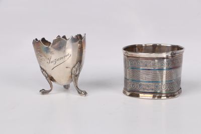silver plated cup and spoon on a white surface