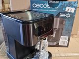 a coffee maker that is sitting on a cardboard box