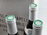 three bottles of wine sitting next to each other on a table