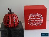 a red box with a black and white pumpkin on it