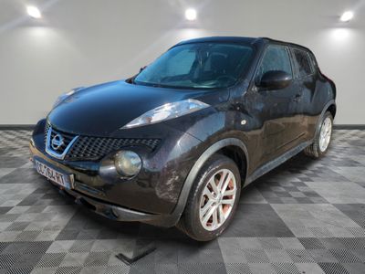 a picture of a black nissan juke parked in a garage