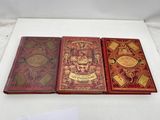 three books that are sitting on a table