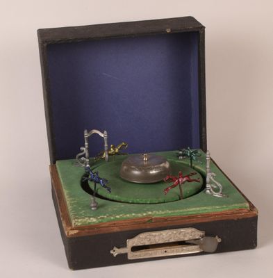 an old record player in a case with a green cover