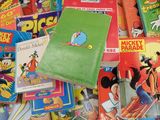 a pile of children ' s books on a table
