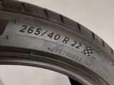 the tire of a car is shown on the side of the wall