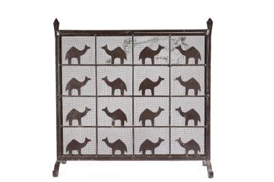 a close up of a metal screen with camels and giraffes on it