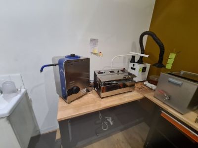 a picture of a kitchen with a sink, microwave and toaster
