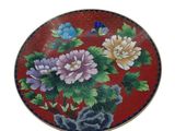 a picture of a decorative plate with flowers painted on it