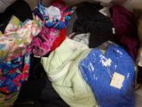 a pile of clothes that is sitting in a box