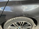 a black car with a bmw emblem on the side of it