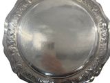 a silver plate on a white background with a white background