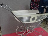 a baby stroller that is sitting on a red table