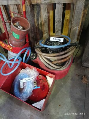 many different types of fire extinguisors and hoses in a box
