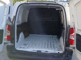 a white van with the back door open and the back door open