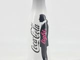 a bottle of coca cola with a man in a tuxedo on it
