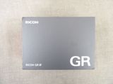 the card is gray and white with the word rico on it