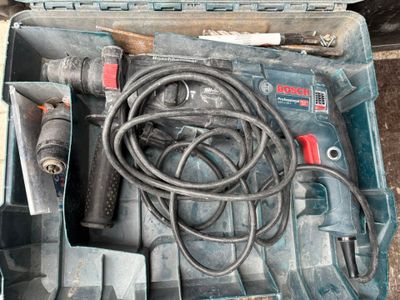 a box with tools in it sitting on the floor