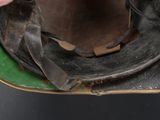 a person holding a pair of shoes on a skateboard