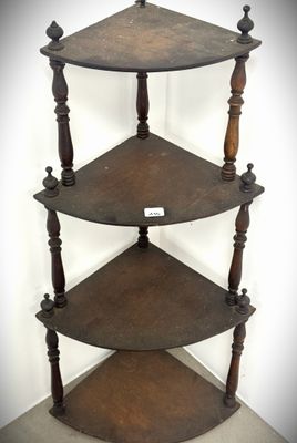 a three tiered wooden shelf with a sign on it