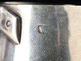 a close up of a metal object with a small hole in it