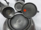 mickey mouse ears made out of metal pots and pans on a table