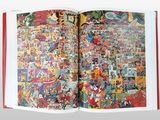 an open book with a bunch of comics on it
