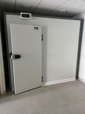 a white door with a black handle in a room