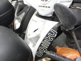 many motorcycles that are parked together in a parking lot