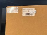 a box with a price label on it sitting on a table