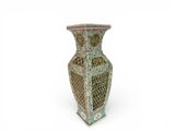a vase that is sitting on a white surface