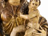 an image of a statue of a woman holding a baby in her arms
