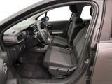 the interior of a car with the driver ' s seat folded down
