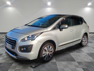 a silver car is parked in a room with a checkered floor