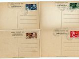 three old postcards with stamps on them sitting on top of each other
