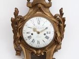 a clock that is hanging on the wall on the wall