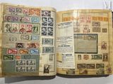 a book with stamps on it sitting on a table