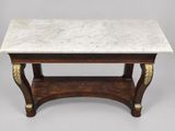 a marble top coffee table with brass accents