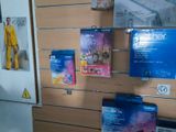 a display of various products on the wall in a store