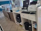an image of a computer and printer in a store