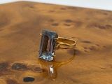 an image of a ring with a green tourmaline on it