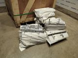 a pile of white bags and a wooden box on the floor
