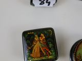 three small boxes are sitting on a table with numbers on them