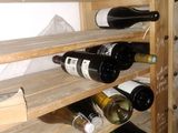 many bottles of wine on the shelves in the wine cellar