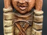an image of a statue of a woman holding a knife