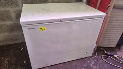 an image of a small white refrigerator in a room