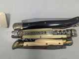 many different types of knives on the table